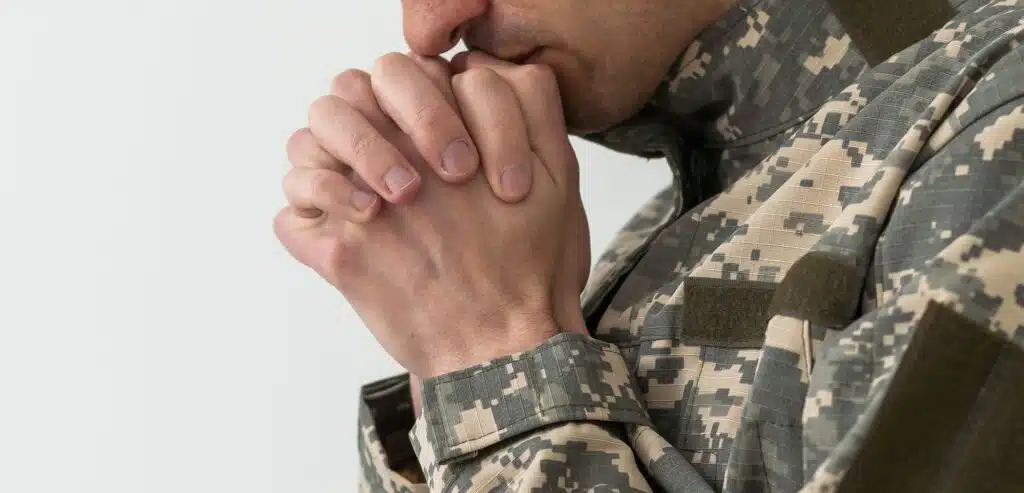 Closeup Shot Of Clasped Hands Of Unrecognizable Soldier In Camouflage Army Uniform, Military man